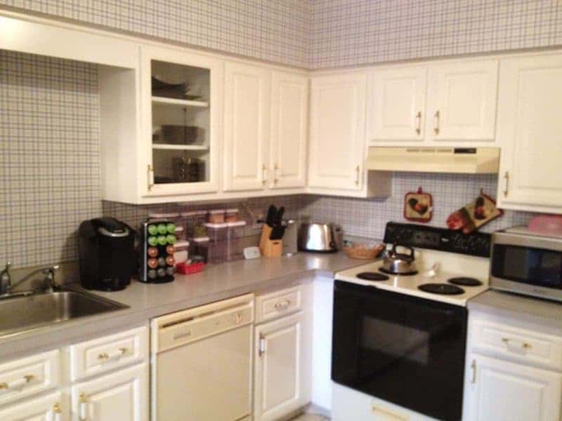 Kitchen with blue spotted laminate countertop.