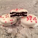 White Chocolate Covered Valentine's Day Oreos with heart sprinkles.