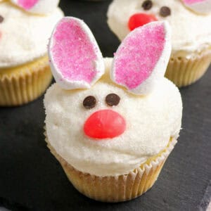 Decorated bunny cupcakes with marshmallow ears and jelly bean nose.