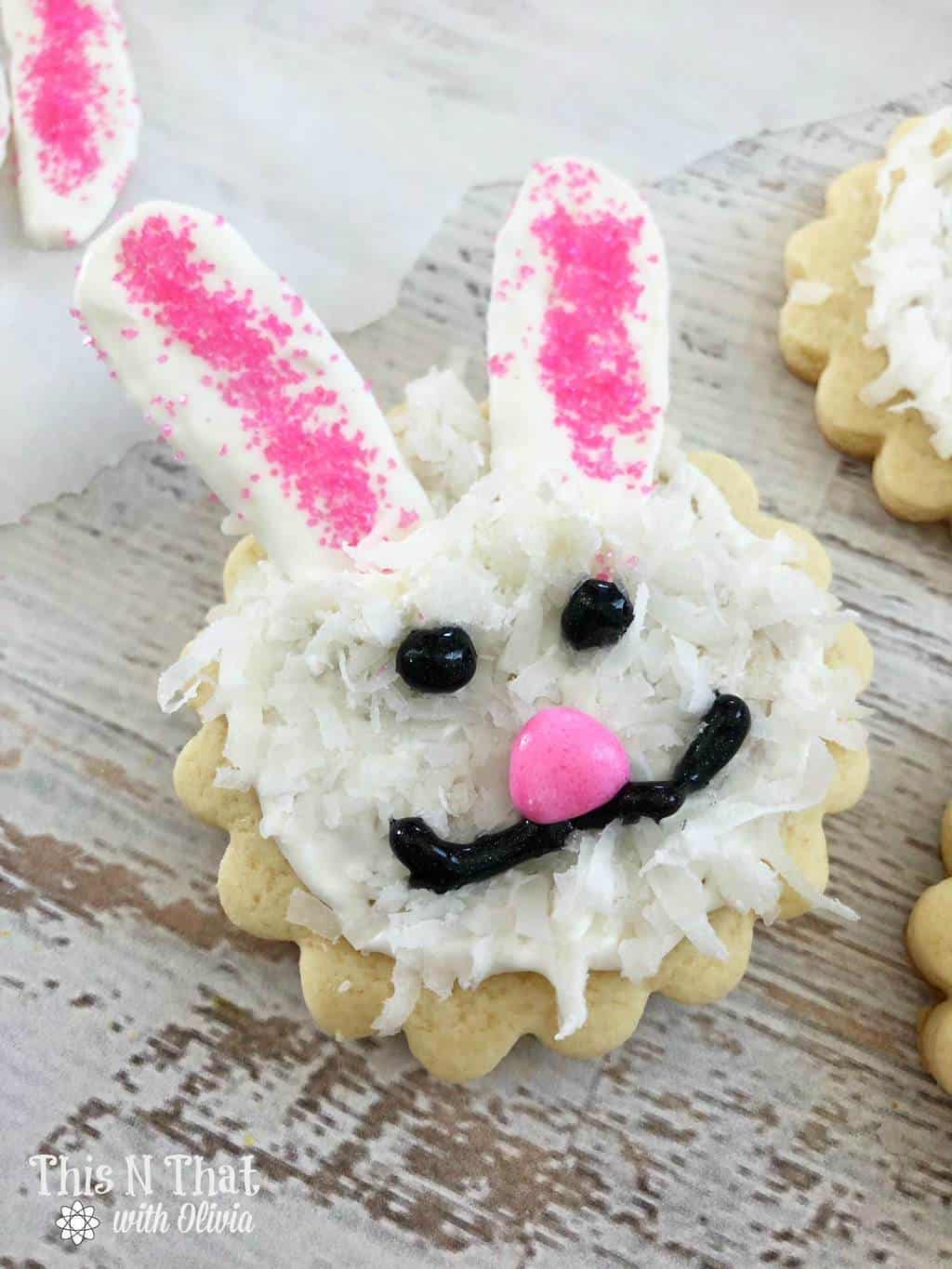 Sugar cookies decorated to look like bunny faces.