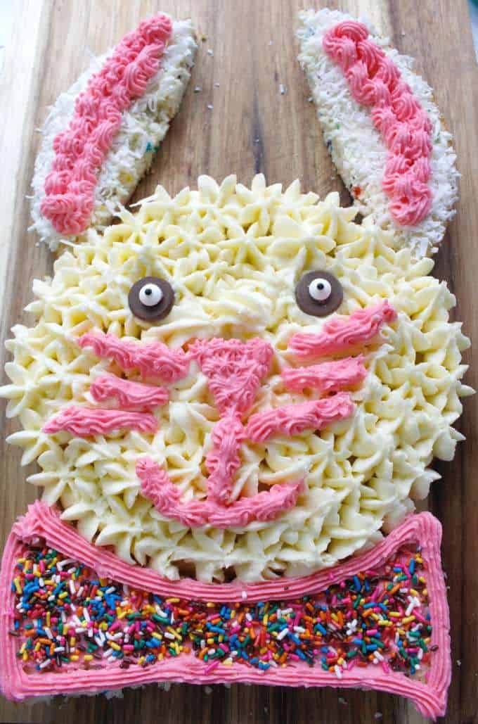 Easter Bunny Cake decorated with frosting and sprinkles.