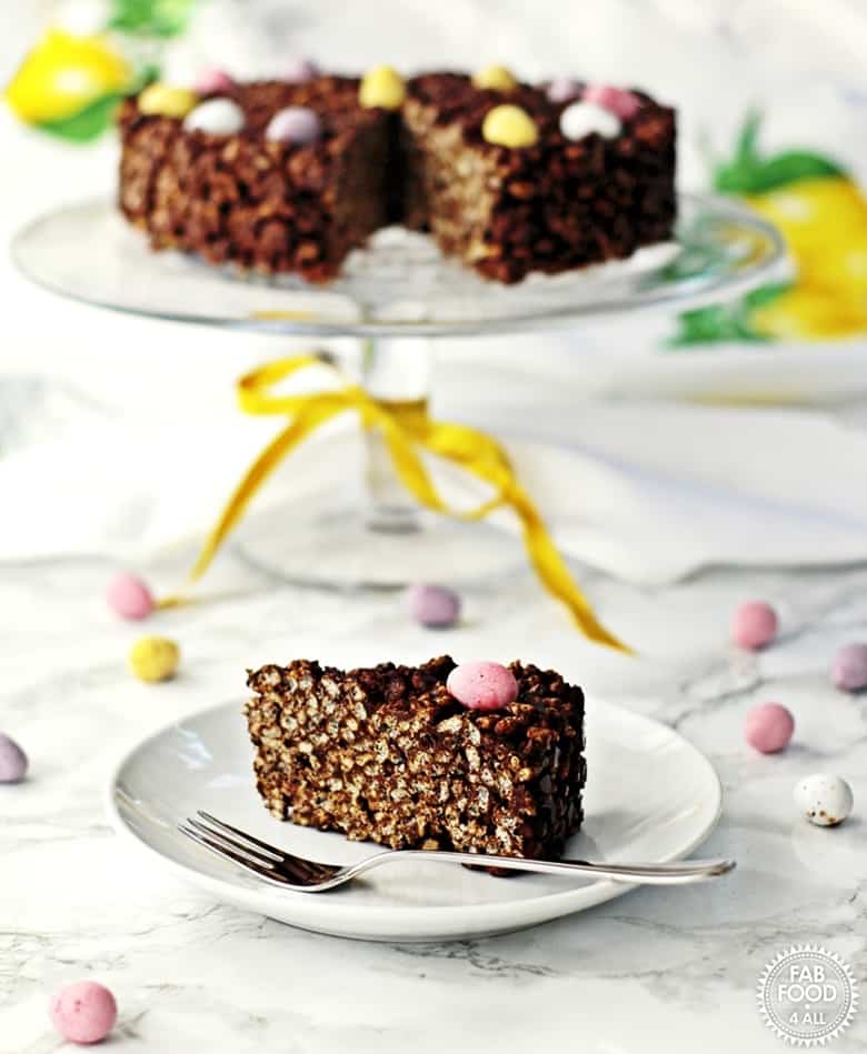 Chocolate Rice Crispy Cake topped with pastel mini candy eggs.