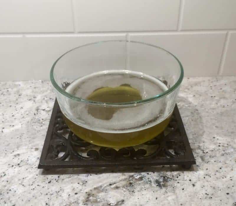 Melted shea butter and oil in bowl.