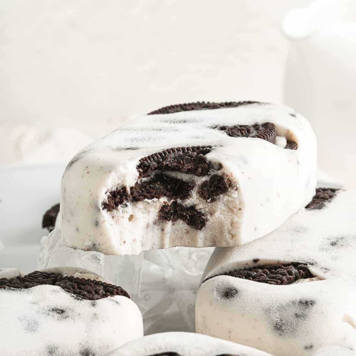Cookies and cream ice pops with pieces of OREO cookies inside.