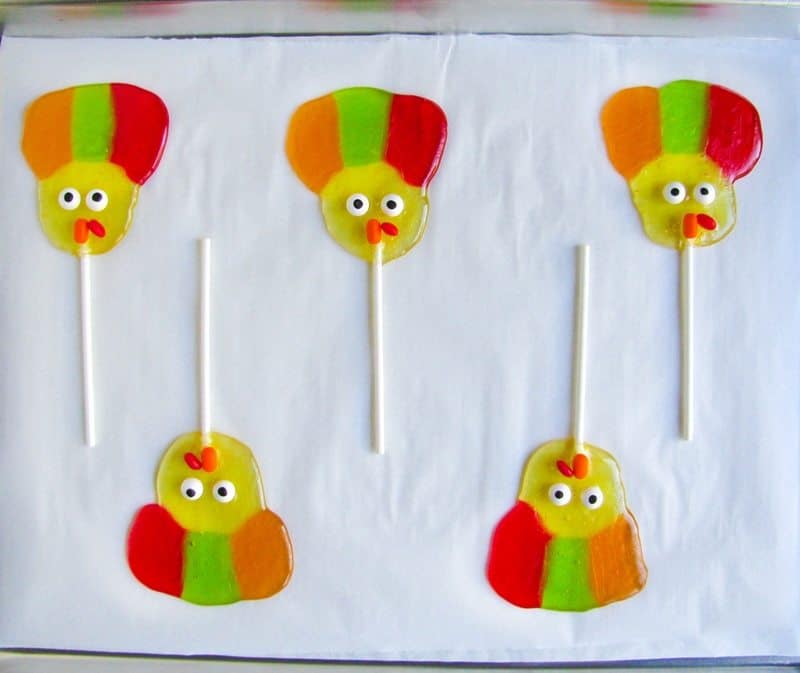 Turkey lollipops completed on lined cookie sheet.
