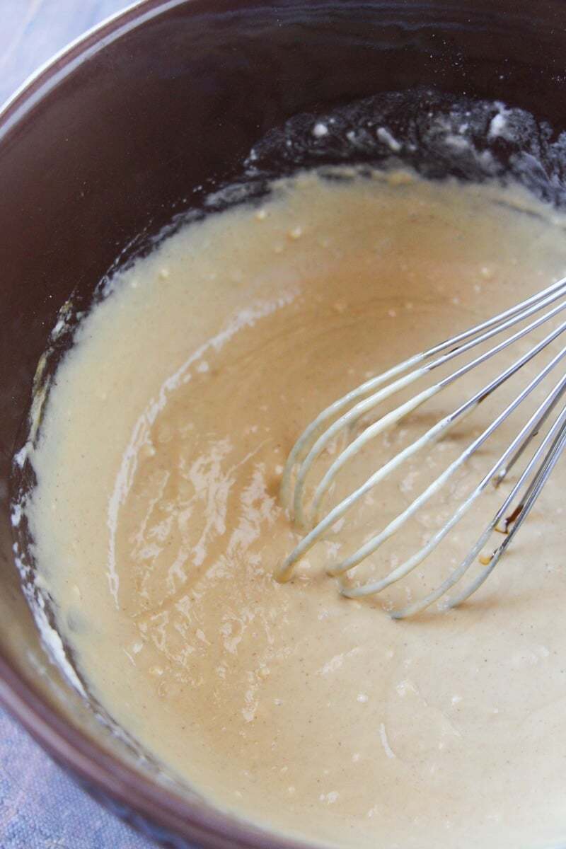 Whisk mixing batter in bowl.