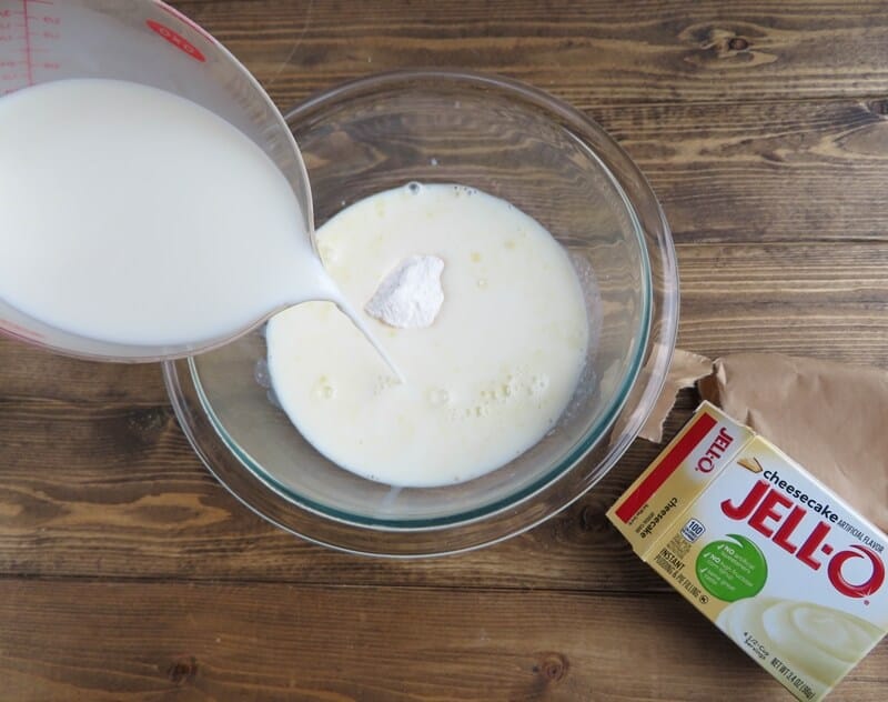 Milk being poured into bowl with pudding mix.