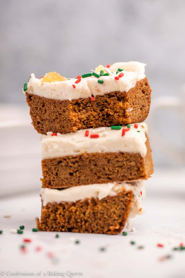 Three frosted gingerbread brownies stacked