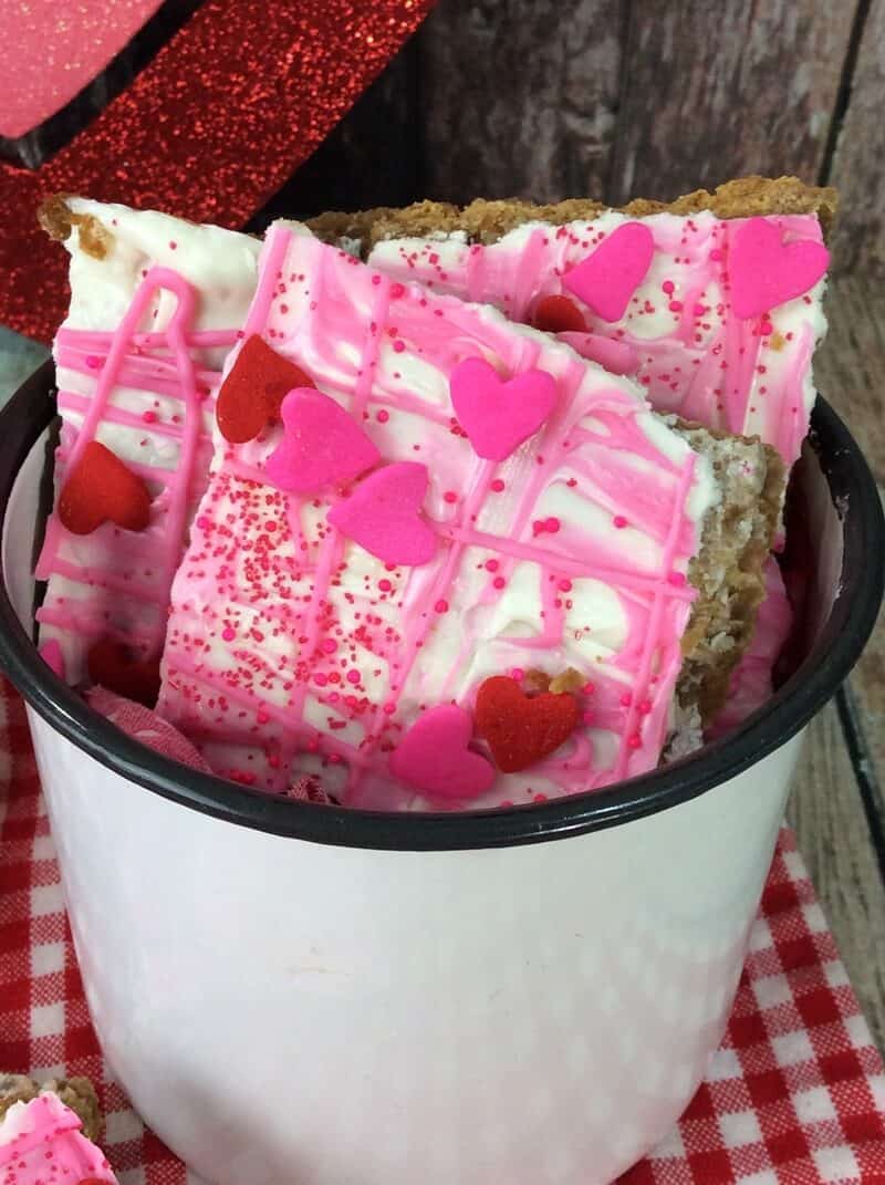 Pieces of Valentine's Day bark candy in white bowl.