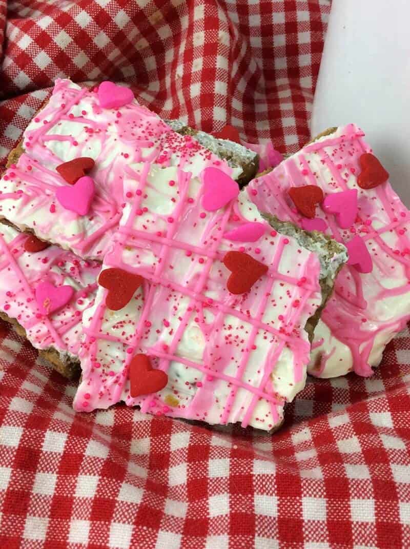 White chocolate graham cracker bark  topped with pink chocolate and sprinkles. 