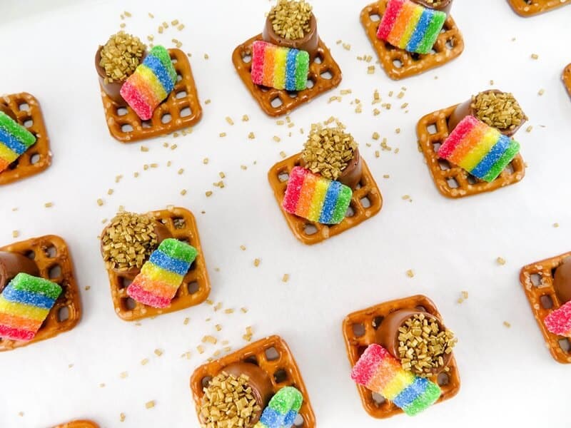 Pretzels with rolo candies, gold sprinkles, and rainbow candies.