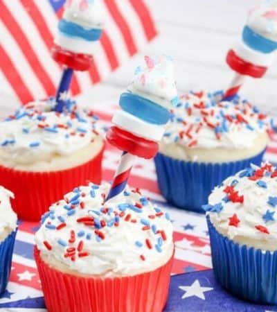 These 4th of July Firework Cupcakes featuring fireworks shooting out of the top make the perfect dessert to serve at your 4th of July party. With Pop Rocks, Hershey Kisses, Lifesavers, and sprinkles, this 4th of July dessert recipe is sure to be a crowd pleaser! 