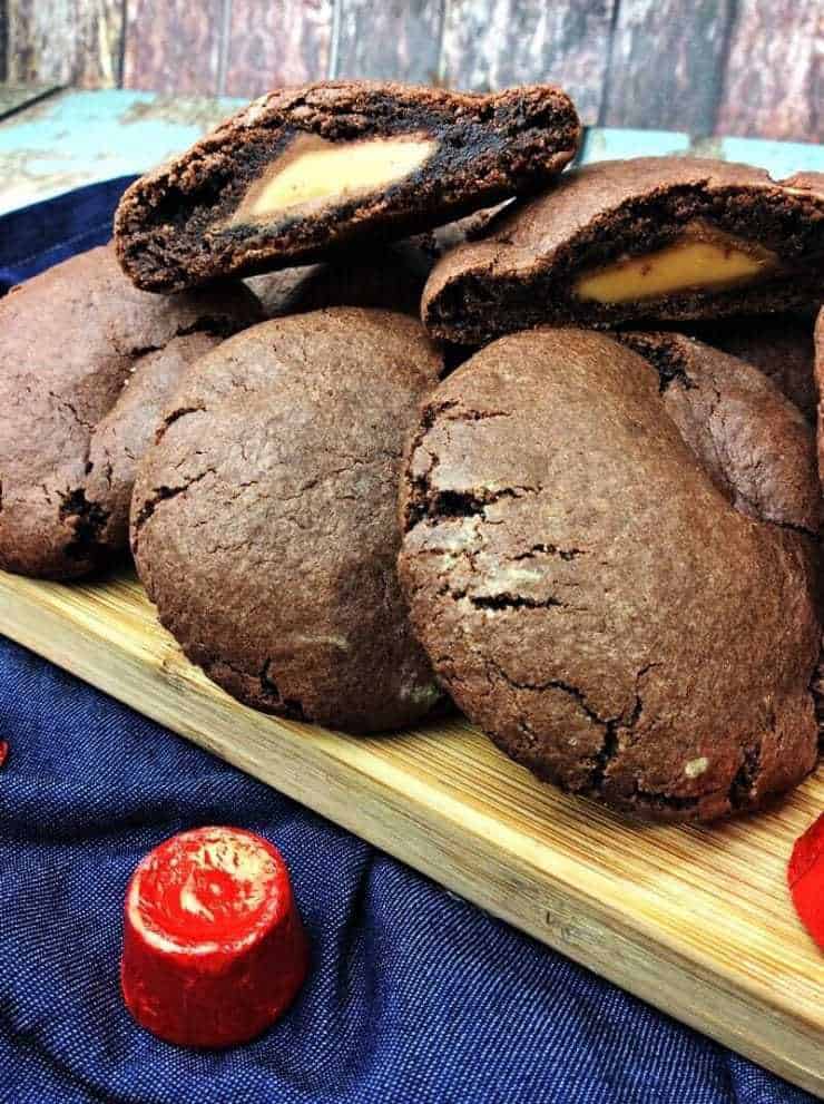 Chocolate cookie sliced in half to show caramel candy center.