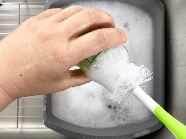 Washing Bottle With Bottle Brush. over dish pan