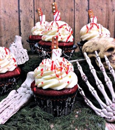 Bloody cupcakes: Red velvet cupcakes with cream cheese frosting and blood splatter.
