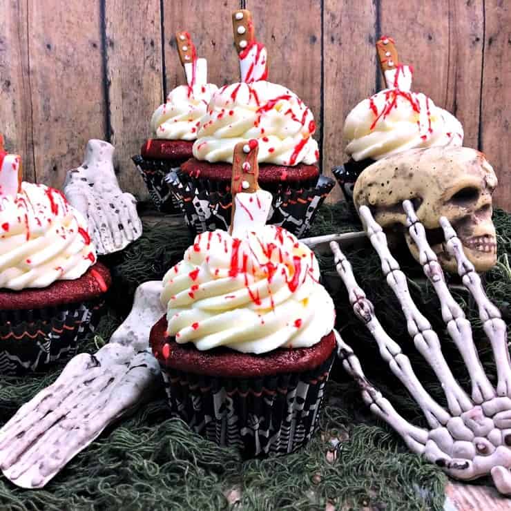 Bloody cupcakes: Red velvet cupcakes with cream cheese frosting and blood splatter.