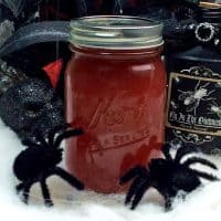 Black widow venom halloween moonshine in mason jar.