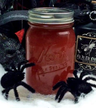 Black widow venom halloween moonshine in mason jar.