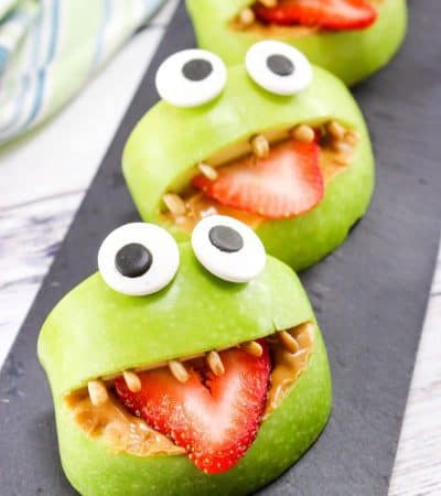 Made with apples, peanut butter, strawberries, sunflower seeds, and edible eyes, these Monster Apple Bites are a fun snack packed with nutrition! Perfect for Halloween or whenever you are looking for a fun snack idea for the kids.