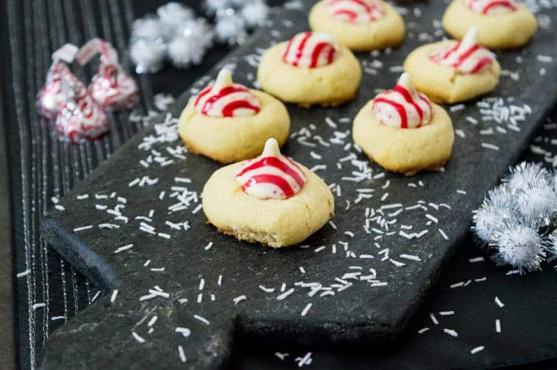 Not only do these Candy Cane Hershey Kiss Cookies look festive, but these holiday cookies have a festive peppermint flavor as well.