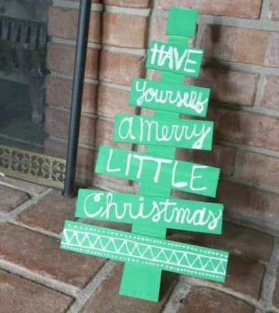 This DIY holiday phrase wooden Christmas tree is the perfect easy DIY Christmas decoration idea. It will make a great addition to your holiday decor.