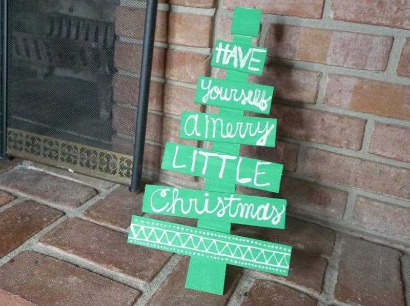 This DIY holiday phrase wooden Christmas tree is the perfect easy DIY Christmas decoration idea. It will make a great addition to your holiday decor.