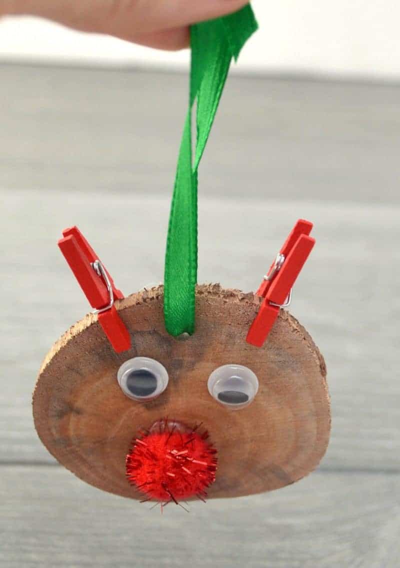 This DIY rustic wood slice Rudolph the red nosed reindeer ornament is easy to make and will look great on your Christmas tree.