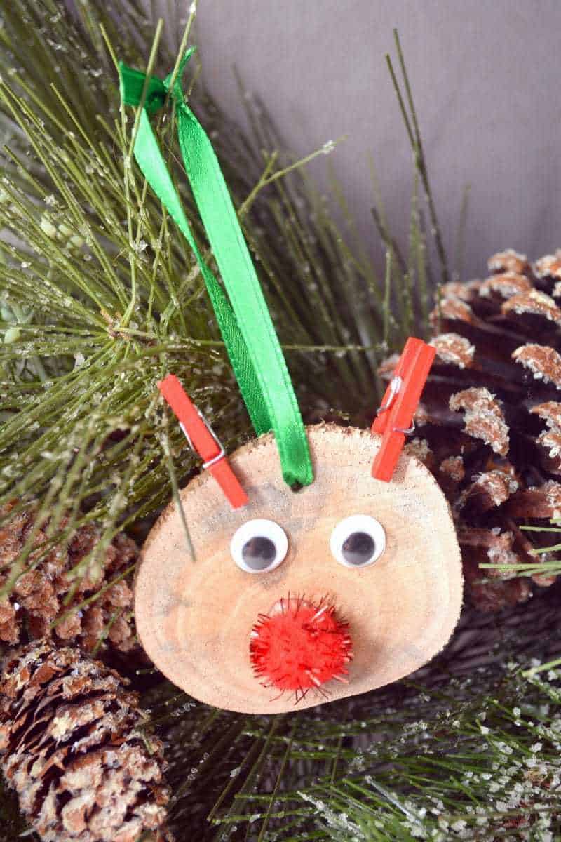 DIY rustic wood slice Rudolph the red nosed reindeer ornament.
