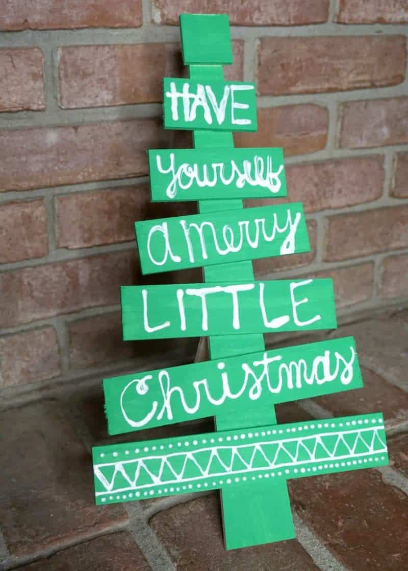 This DIY holiday phrase wooden Christmas tree is the perfect easy DIY Christmas decoration idea. It will make a great addition to your holiday decor.