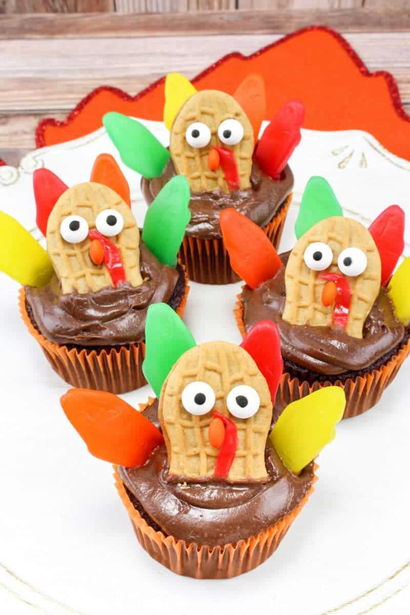 Made with Nutter Butters, Fruit Roll-Ups, Swedish Fish, and mini M&Ms, turkey cupcakes are colorful, tasty, and so much fun for the kids to help create.