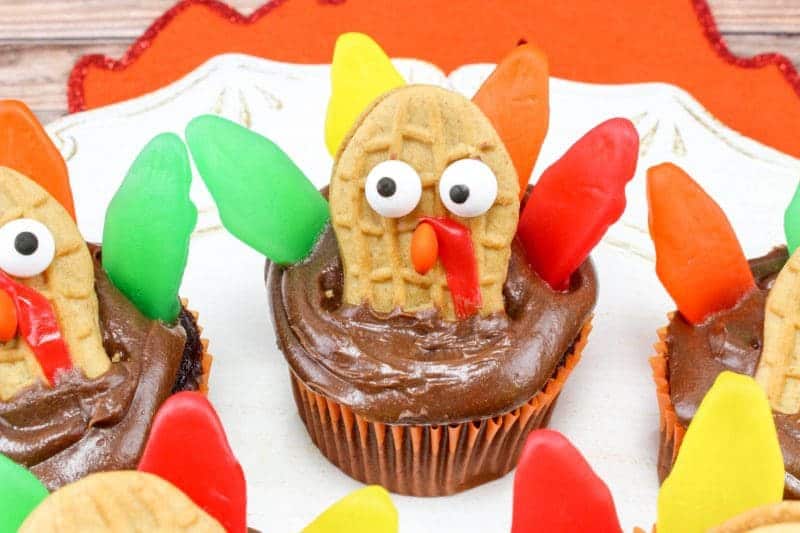 Made with Nutter Butters, Fruit Roll-Ups, Swedish Fish, and mini M&Ms, turkey cupcakes are colorful, tasty, and so much fun for the kids to help create.