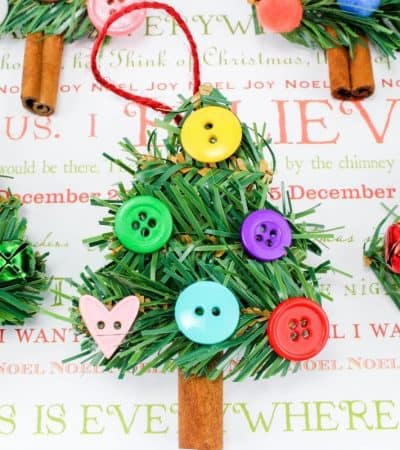 A fun DIY homemade Christmas Tree Ornament craft. made using wreath garland, cinnamon sticks, buttons, pom poms and jingle bells.
