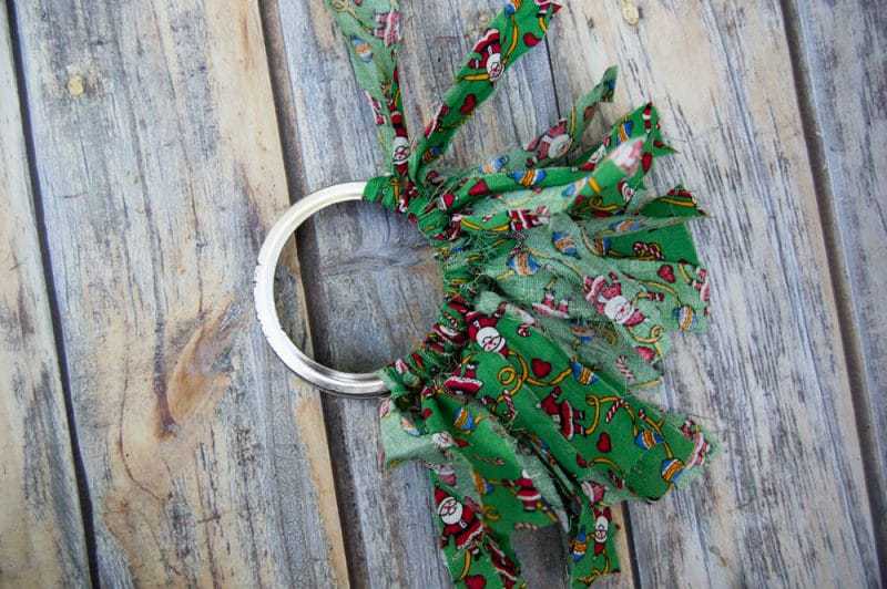 Mason canning jar lid Christmas wreath ornaments are great  for giving your tree that homemade rustic feel, and can be customized with any color fabric.