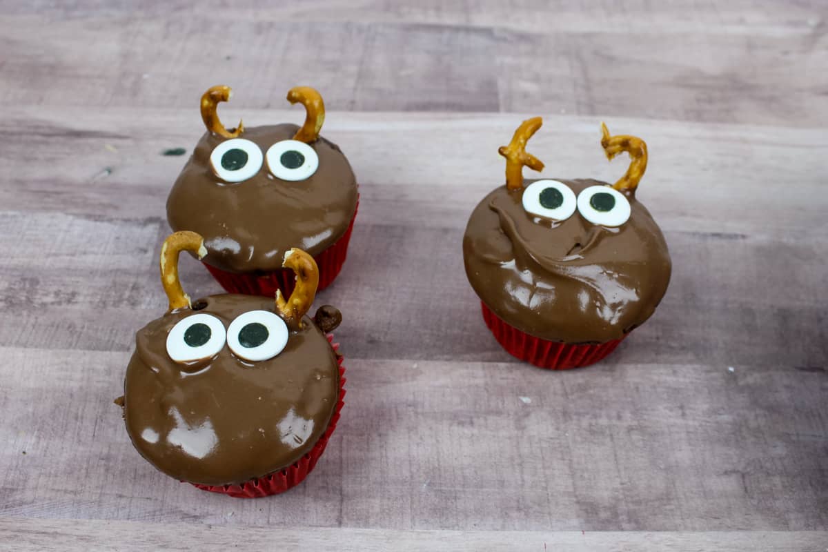 Reindeer cupcakes with large candy eyes added.