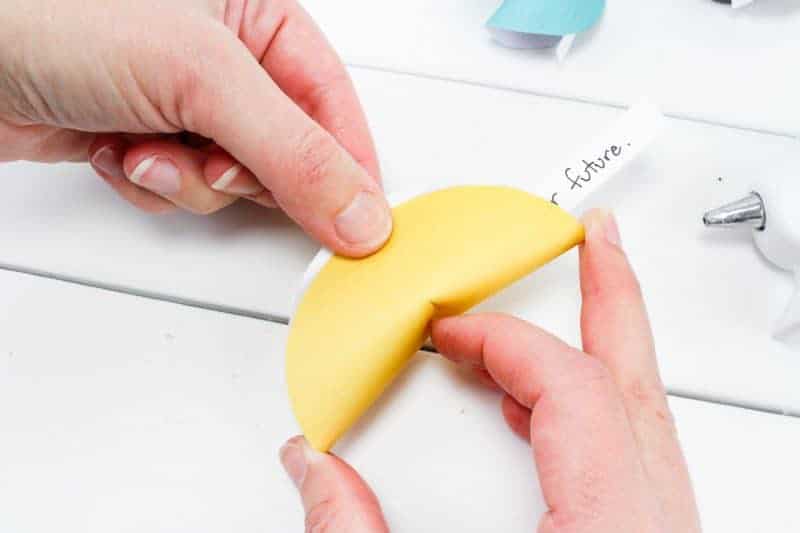 This paper fortune cookies craft will make a fun favor and decoration for your New Year's Eve party! Fill the paper fortune cookies with fun predictions for the New Year for your guests.