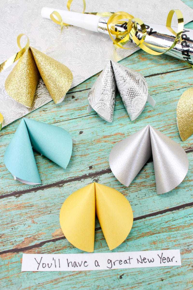 This paper fortune cookies craft will make a fun favor and decoration for your New Year's Eve party! Fill the paper fortune cookies with fun predictions for the New Year for your guests.