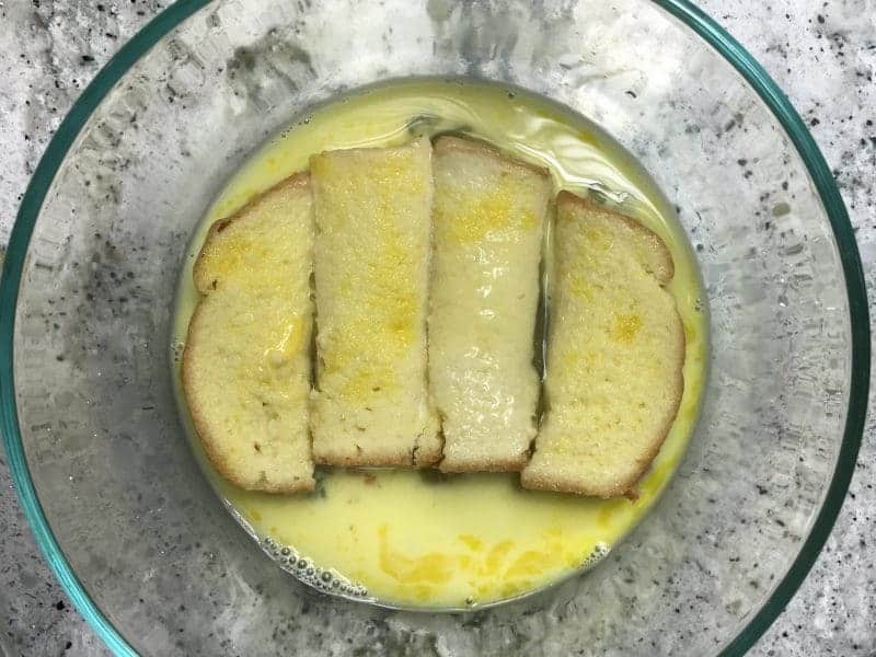 Cut bread into 4 strips and set aside.  Combine eggs, milk, and vanilla in a bowl and beat lightly.