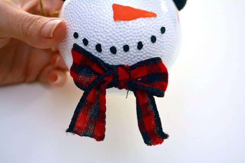 This handmade snowman Christmas ornament is fun and easy for the kids to make using clear plastic ball fillable ornaments.