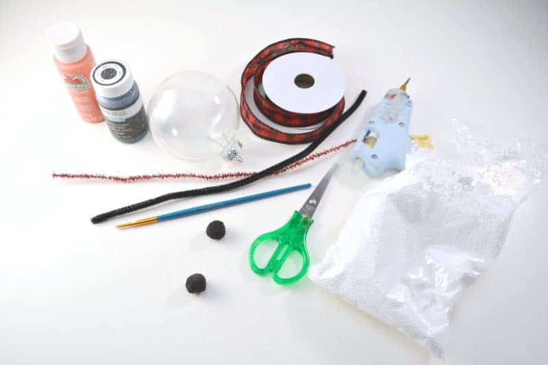 This handmade snowman Christmas ornament is fun and easy for the kids to make using clear plastic ball fillable ornaments.