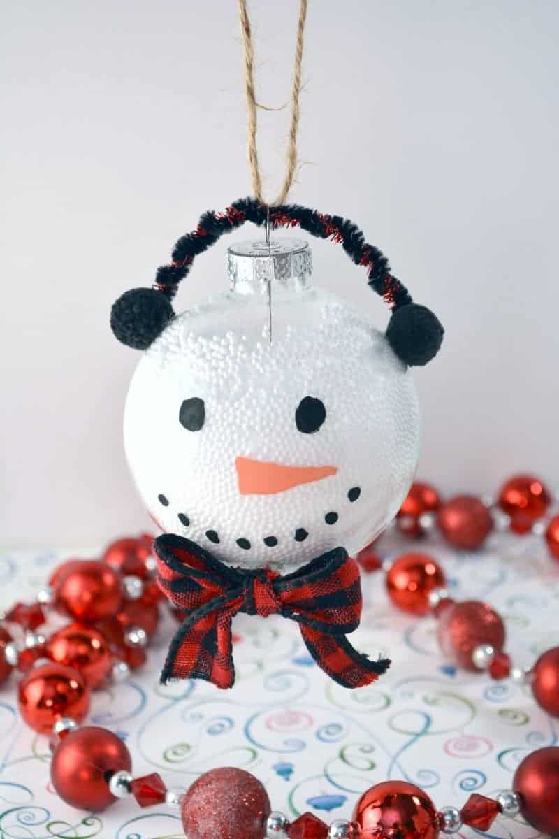 This handmade snowman Christmas ornament is fun and easy for the kids to make using clear plastic ball fillable ornaments.