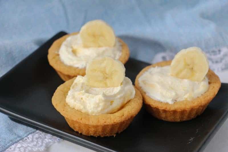 Moist, creamy, and delicious banana cream cookie cups are easy to make with sugar cookie dough and banana pudding mix. Even the little ones can get in the kitchen and help make these easy and delicious treats!
