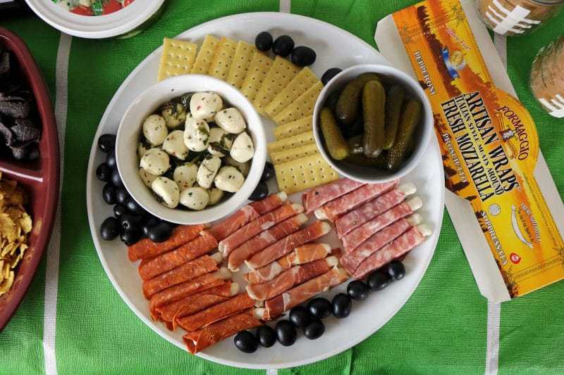 A fun and easy football themed party spread including a recipe for mini mac & cheese cups. Also included are a DIY Game Day banner printable, DIY Game Day toothpick topper printable, and printable football buffet table labels all available for download - for free!