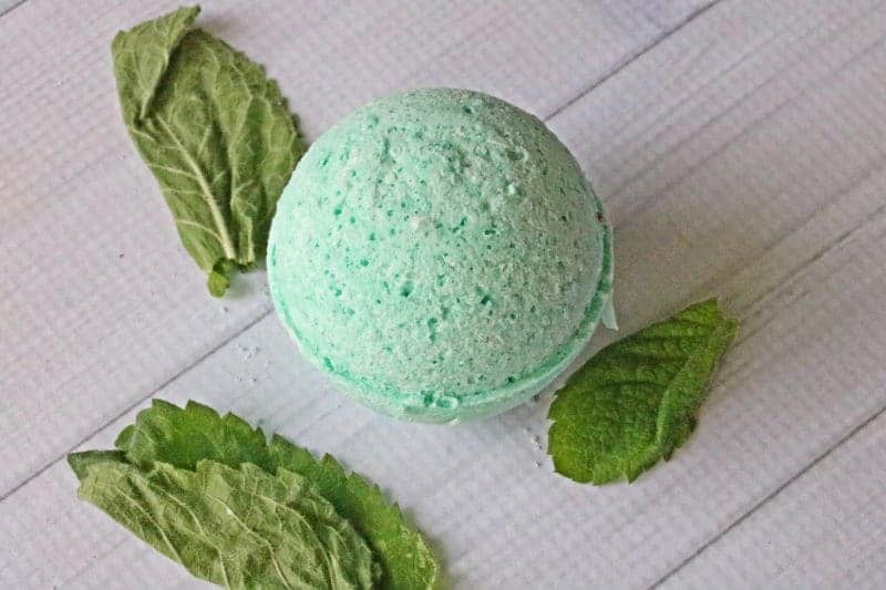 Get headache relief naturally with a nice hot bath and a homemade headache bath bomb. Made with soothing lavender and peppermint essential oils, this natural headache remedy is easy to make right at home.