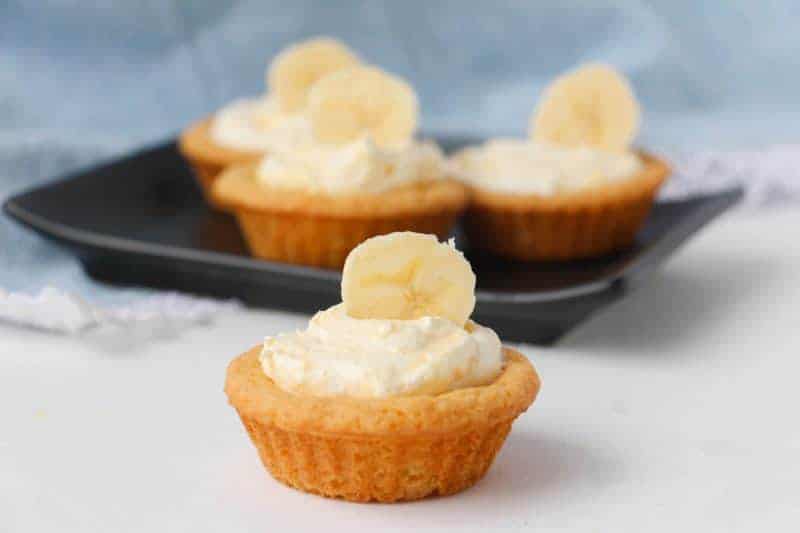 Creamy and delicious banana cream cookie cups are easy to make with sugar cookie dough and banana pudding mix. Even the little ones can get in the kitchen and help make these easy and delicious treats!