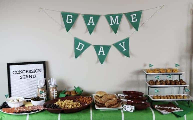 A fun and easy football themed party spread including a recipe for mini mac & cheese cups. Also included are a DIY Game Day banner printable, DIY Game Day toothpick topper printable, and printable football buffet table labels all available for download - for free!