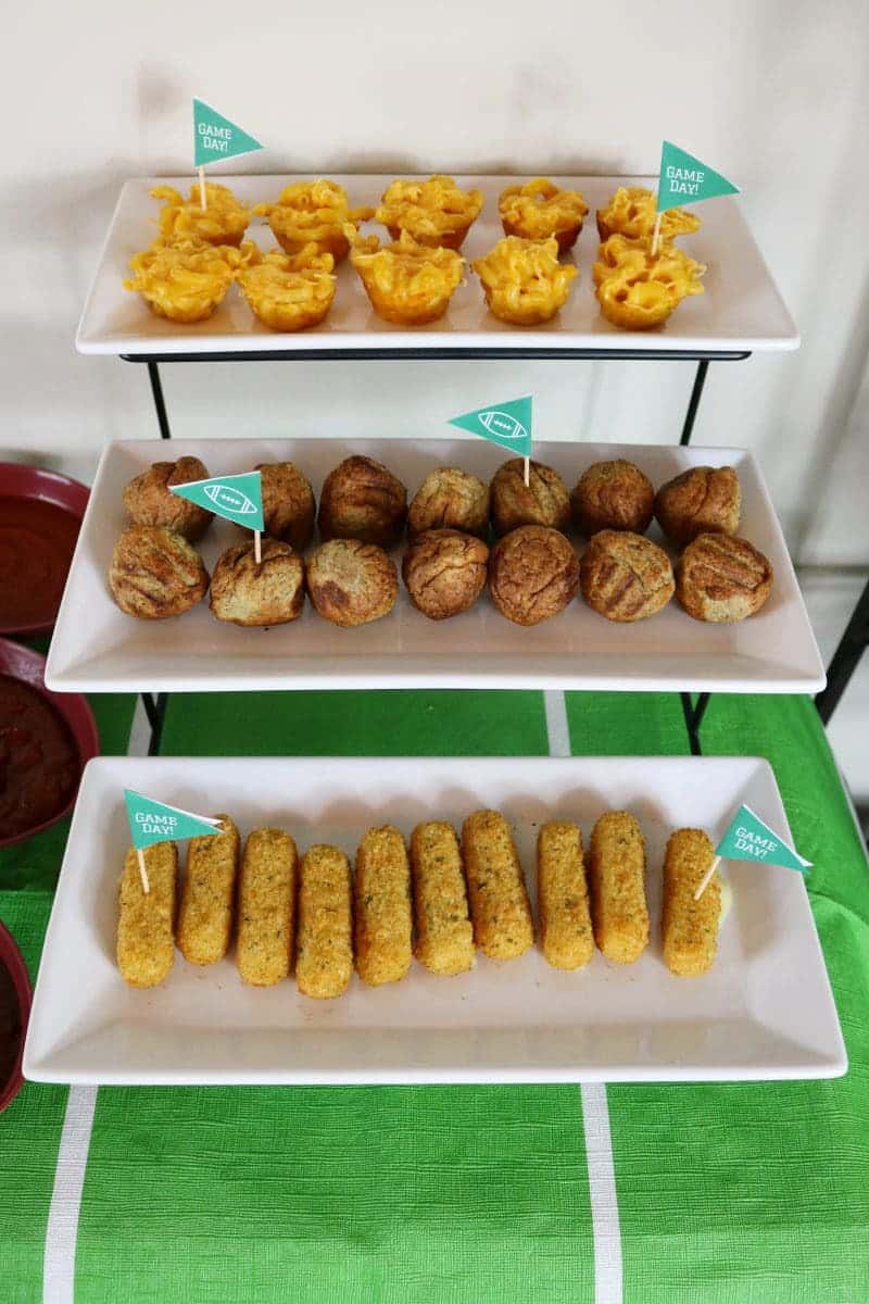 A fun and easy football themed party spread including a recipe for mini mac & cheese cups. Also included are a DIY Game Day banner printable, DIY Game Day toothpick topper printable, and printable football buffet table labels all available for download - for free!