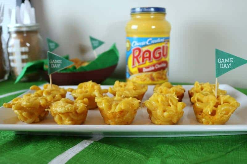 A fun and easy football themed party spread including a recipe for mini mac & cheese cups. Also included are a DIY Game Day banner printable, DIY Game Day toothpick topper printable, and printable football buffet table labels all available for download - for free!