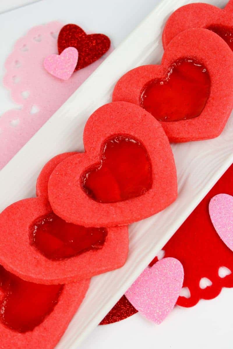 Are you looking for a unique cookie that your kids will absolutely love? These Valentine stained glass heart cookies are a must for Valentine’s Day. Not only do you get the delicious sugar cookie, but you also get yummy candy. It’s two treats in one! What kid would be able to resist?