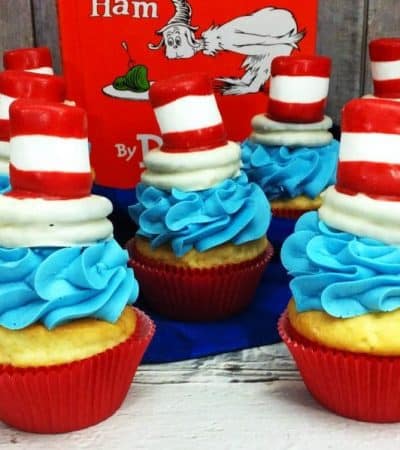 Cat in the Hat cupcakes are the perfect treat to make for a Dr. Seuss Day party or Dr. Seuss birthday party. Made using boxed cake mix and premade frosting, the only thing you really need to spend time on is the fun Cat and the Hat topper that sits on top of the cupcakes!
