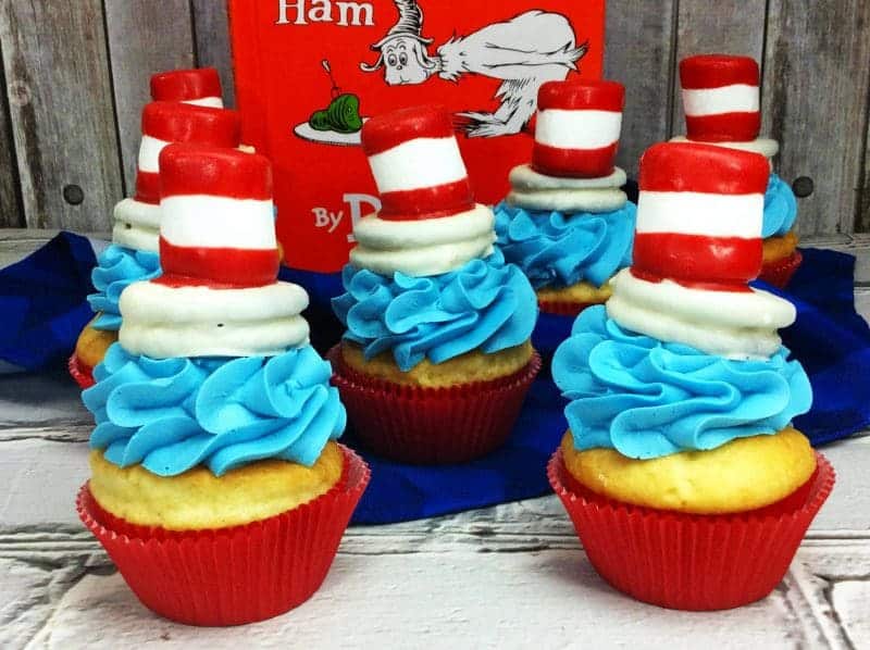 Cat in the Hat cupcakes are the perfect treat to make for a Dr. Seuss Day party or Dr. Seuss birthday party. Made using boxed cake mix and premade frosting, the only thing you really need to spend time on is the fun Cat and the Hat topper that sits on top of the cupcakes!